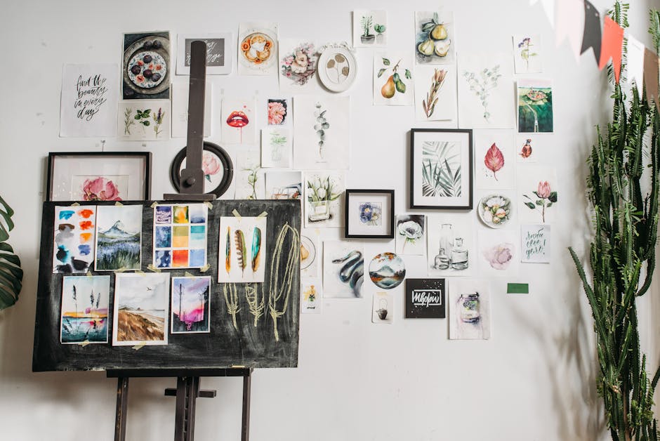 Art studio with watercolor artworks and canvas on easel, a space for creative inspiration.